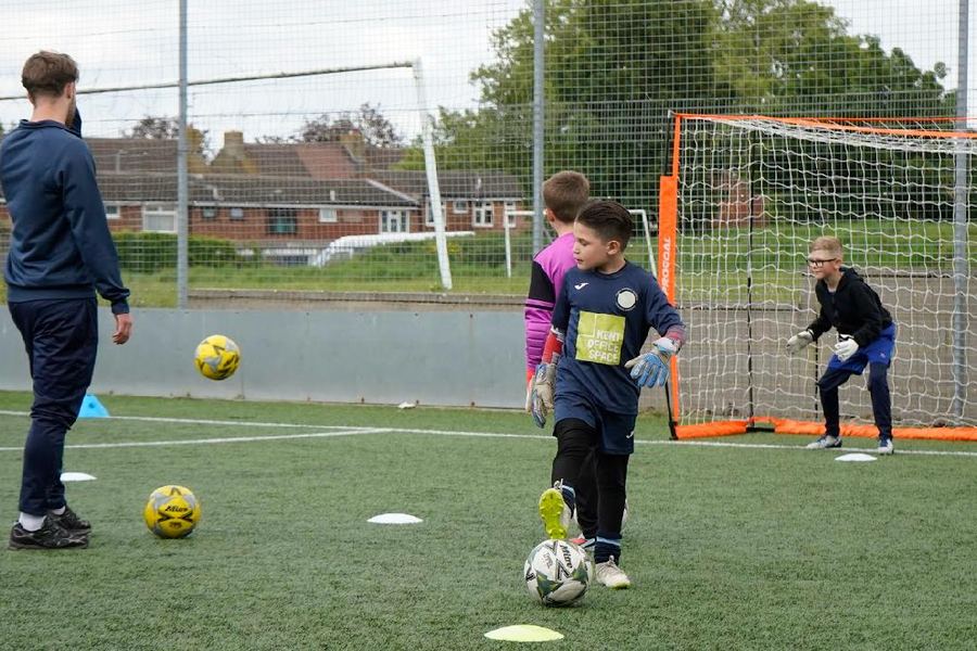 Young goalkeeper in training
